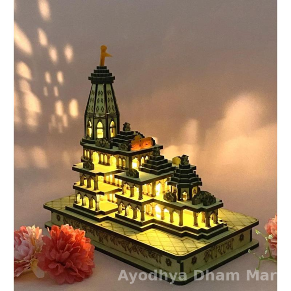 Illuminated Ram Mandir model with intricate carvings, showcased on a decorative base, glowing warmly with LED lights – a handcrafted miniature replica inspired by the Ayodhya Ram Temple.